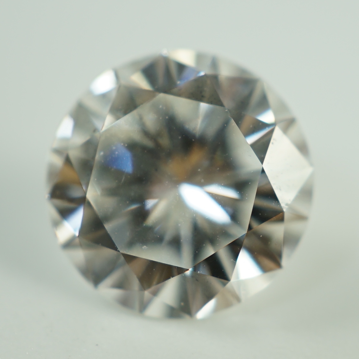 A white metal mounted round brilliant cut diamond, with GIA report dated 27/3/2023 stating the stone to weigh 2.45ct with a colour and clarity of F and SI1.